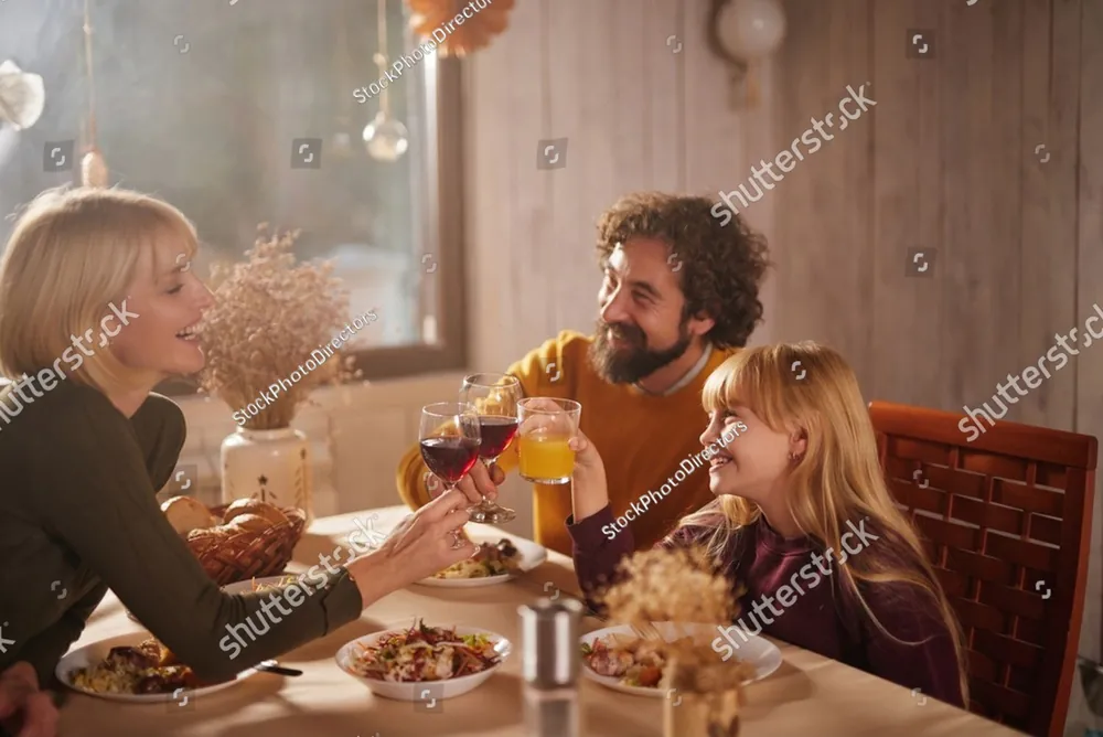 A family laughing together around the dinner table